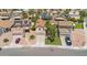 Aerial view of a house with desert landscaping, two car garage and lawn at 3608 W Harrison St, Chandler, AZ 85226