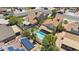 Aerial view featuring a pool, backyard amenities, and solar panels, set in a residential community at 3608 W Harrison St, Chandler, AZ 85226