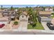 Aerial view of a home with a well-manicured lawn, desert landscaping, and a two-car garage at 3608 W Harrison St, Chandler, AZ 85226