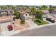 Aerial view of a home with desert landscaping, a two-car garage, and solar panels at 3608 W Harrison St, Chandler, AZ 85226