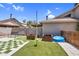 Backyard featuring artificial grass, wood planters, bench, and pavers in a checkerboard design at 3608 W Harrison St, Chandler, AZ 85226