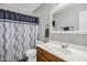 Bathroom featuring a vanity, toilet, mirror, and shower with curtain at 3608 W Harrison St, Chandler, AZ 85226