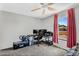 Comfortable bedroom with desk, ceiling fan, and bright window for natural light at 3608 W Harrison St, Chandler, AZ 85226