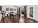 Cozy dining room with hardwood floors, a wooden table, modern light fixtures, and easy access to the backyard at 3608 W Harrison St, Chandler, AZ 85226