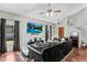 Spacious living room with vaulted ceilings, hardwood floors, comfortable seating, and a modern entertainment setup at 3608 W Harrison St, Chandler, AZ 85226