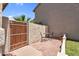 Side patio area with wood gate, small table with two chairs at 3608 W Harrison St, Chandler, AZ 85226