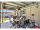 Covered patio with table, chairs, ceiling fan, and view of the backyard at 3608 W Harrison St, Chandler, AZ 85226