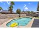 Backyard pool with a yellow inflatable ring, surrounded by concrete, block wall, and landscaping at 3608 W Harrison St, Chandler, AZ 85226