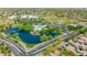 Wonderful aerial view of community amenities, including a pool, lake, park, and green spaces within a residential area at 3745 E Flamingo Way, Gilbert, AZ 85297