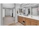Bathroom featuring double sinks and a large mirror at 3745 E Flamingo Way, Gilbert, AZ 85297
