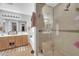 Bathroom showcasing a glass-enclosed shower and a bathtub at 3745 E Flamingo Way, Gilbert, AZ 85297