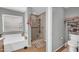 A bathroom featuring a walk-in shower and a commode at 3745 E Flamingo Way, Gilbert, AZ 85297