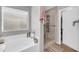 Bathroom featuring a soaking tub and a glass shower enclosure at 3745 E Flamingo Way, Gilbert, AZ 85297
