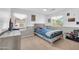 Bright bedroom featuring a wooden bed, natural light, and neutral walls at 3745 E Flamingo Way, Gilbert, AZ 85297