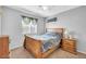 Comfortable bedroom with natural lighting, a bed, and matching nightstand and dresser at 3745 E Flamingo Way, Gilbert, AZ 85297