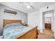 Comfortable bedroom featuring a bed, closet, and views into the bathroom at 3745 E Flamingo Way, Gilbert, AZ 85297