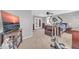 A spacious bedroom with an exercise machine and television at 3745 E Flamingo Way, Gilbert, AZ 85297