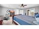 Spacious bedroom with carpeted floor, ceiling fan, and doors to balcony at 3745 E Flamingo Way, Gilbert, AZ 85297