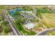 Aerial view showcasing neighborhood amenities including a community center and lake at 3745 E Flamingo Way, Gilbert, AZ 85297