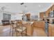 Modern kitchen with a island and granite countertops and Stainless steel appliances and an open concept to the living room at 3745 E Flamingo Way, Gilbert, AZ 85297