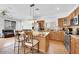 Well-equipped kitchen with granite countertops, stainless steel appliances, and a center island with seating at 3745 E Flamingo Way, Gilbert, AZ 85297