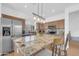 Modern kitchen with a granite countertops and Stainless steel appliances and a breakfast bar at 3745 E Flamingo Way, Gilbert, AZ 85297