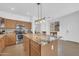 Modern kitchen with a granite countertops and Stainless steel appliances and an open concept to the dining room at 3745 E Flamingo Way, Gilbert, AZ 85297