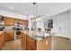 Bright kitchen featuring granite counters, an island with pendant lights, and stainless steel appliances at 3745 E Flamingo Way, Gilbert, AZ 85297