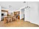 Open-concept kitchen with a granite island, dining area, and tile flooring at 3745 E Flamingo Way, Gilbert, AZ 85297