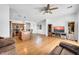 Open-concept living space with wood floors, seamlessly connecting the living room and kitchen at 3745 E Flamingo Way, Gilbert, AZ 85297