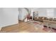 Open-concept living room with stairs, wood floors, and a comfortable couch at 3745 E Flamingo Way, Gilbert, AZ 85297