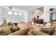 Comfortable living room featuring a staircase, hardwood floors, and cozy furnishings at 3745 E Flamingo Way, Gilbert, AZ 85297