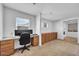 Home office with built-in desk, ample storage, and bright natural light at 3745 E Flamingo Way, Gilbert, AZ 85297