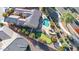 Aerial view of home featuring a putting green, pool, solar panels, and low maintenance landscaping at 42318 W Abbey Rd, Maricopa, AZ 85138