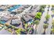 Aerial view of a property featuring a backyard pool, putting green, and a neighborhood canal nearby at 42318 W Abbey Rd, Maricopa, AZ 85138