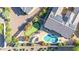 Aerial view highlighting a residence with a putting green, swimming pool, and solar panels on the roof at 42318 W Abbey Rd, Maricopa, AZ 85138