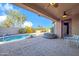 Covered back patio overlooking a pool and spa, with ample space for seating and outdoor gatherings at 42318 W Abbey Rd, Maricopa, AZ 85138