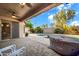 Relaxing back patio with a pool, spa, and covered seating area, perfect for outdoor entertaining at 42318 W Abbey Rd, Maricopa, AZ 85138