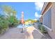 Backyard view of a sparkling pool, patio, and lush landscaping, offering a private outdoor retreat at 42318 W Abbey Rd, Maricopa, AZ 85138