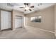 Bedroom includes a walk-in closet and a large window offering a view to the outdoors at 42318 W Abbey Rd, Maricopa, AZ 85138