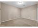 Bare bedroom offering neutral walls and carpeted floors, awaiting personalization at 42318 W Abbey Rd, Maricopa, AZ 85138