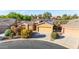 Charming single-story home with a well-maintained front yard and a two-car garage at 42318 W Abbey Rd, Maricopa, AZ 85138