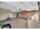 Spacious garage with ample storage cabinets and room for vehicles, tools, and equipment at 42318 W Abbey Rd, Maricopa, AZ 85138