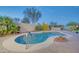 Private backyard featuring a refreshing swimming pool with a convenient handrail at 42318 W Abbey Rd, Maricopa, AZ 85138