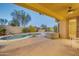 Backyard oasis with a sparkling pool, spa, and lush landscaping at 42318 W Abbey Rd, Maricopa, AZ 85138