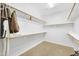 Organized walk-in closet featuring rods and shelves providing ample storage space at 42318 W Abbey Rd, Maricopa, AZ 85138