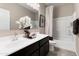Bright bathroom featuring a double sink vanity, decorative accents, and a shower-tub combination at 5106 E Midnight Star Dr, San Tan Valley, AZ 85143