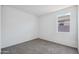 Corner bedroom with one window, neutral carpet, and white walls at 5106 E Midnight Star Dr, San Tan Valley, AZ 85143
