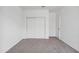 Bedroom with a sliding door closet, interior door, and neutral carpet at 5106 E Midnight Star Dr, San Tan Valley, AZ 85143