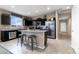 Kitchen showcasing granite countertops, stainless steel appliances, and a central island with seating at 5106 E Midnight Star Dr, San Tan Valley, AZ 85143